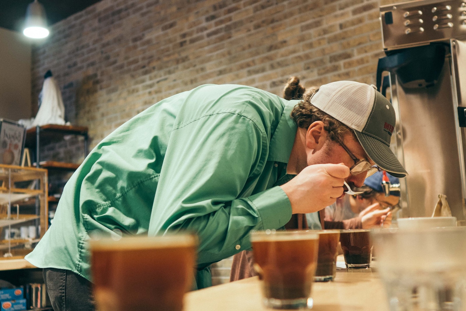 person drinking in a room close-up photography